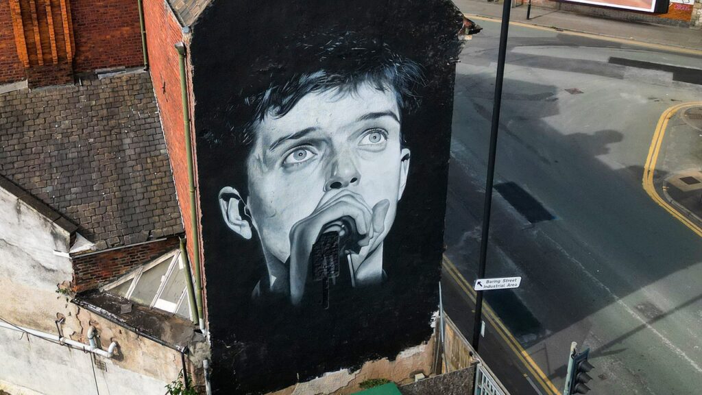 Joy Division Mural That Was Scrubbed for Aitch Album Ad Finally Repainted in Manchester