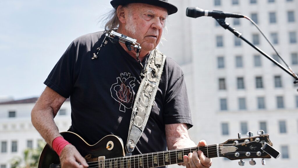 Neil Young Takes Direct Aim At Tesla On New Single 'Let's Roll Again'