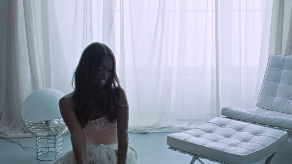 Watch John Glacier Live Out Her 007 Fantasies in New “Bond Girl” Video