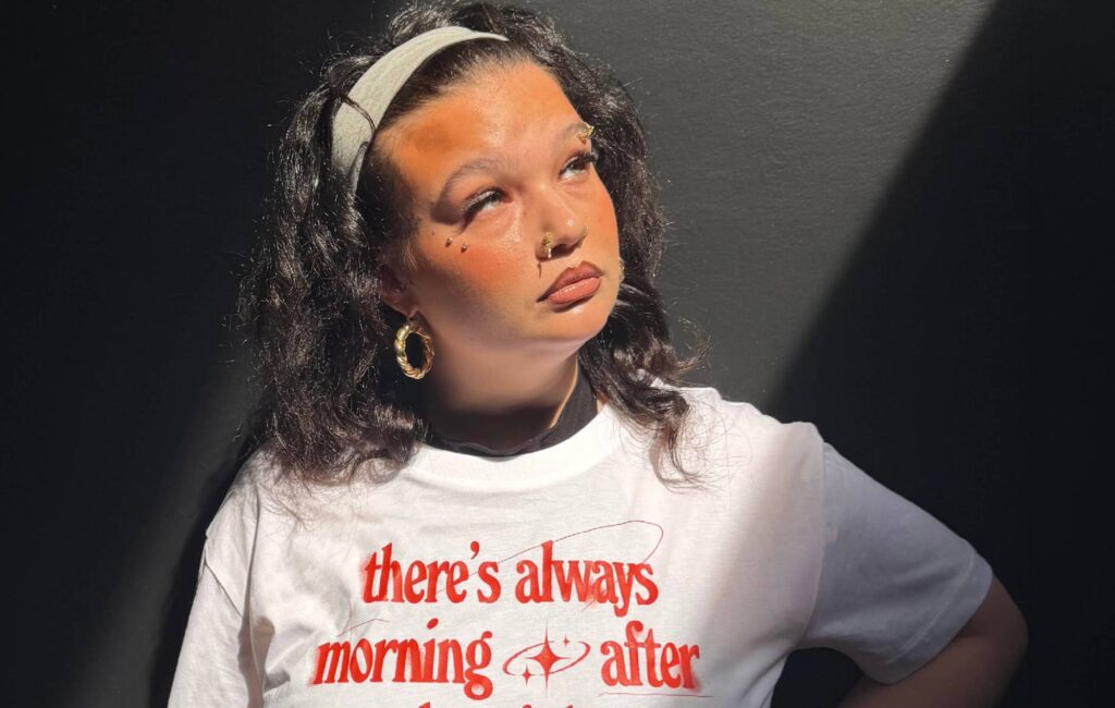 Lola Young teams up with mental health charity CALM for new Lifelines T-shirt: “There is always a reason to keep going”